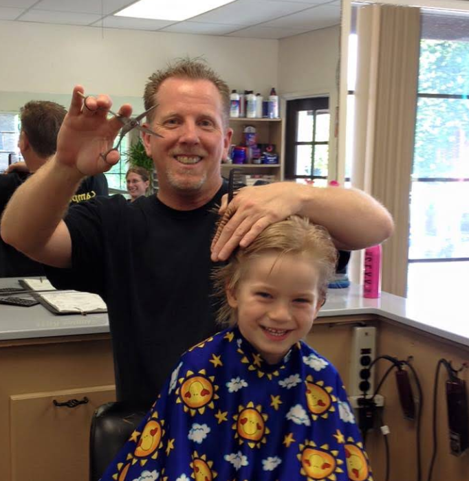 Fritz giving a young man a trim