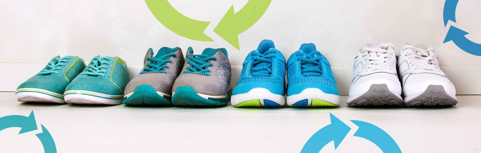 A lineup of sneakers with recycling logos